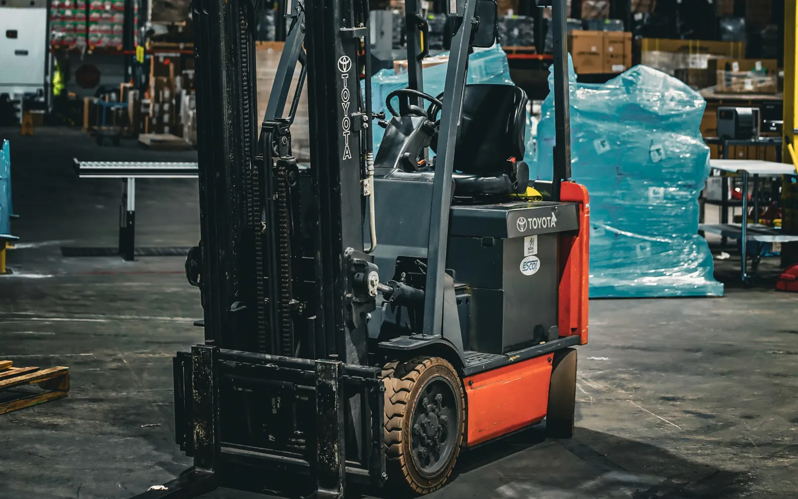 Used Toyota electric counterbalanced forklift in a warehouse, for sale in the DC metro