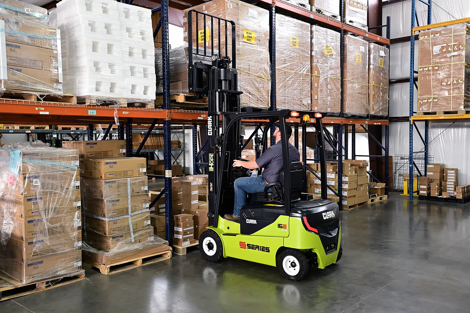 Forklift working in front of pallet racking at a warehouse in Manassas, VA